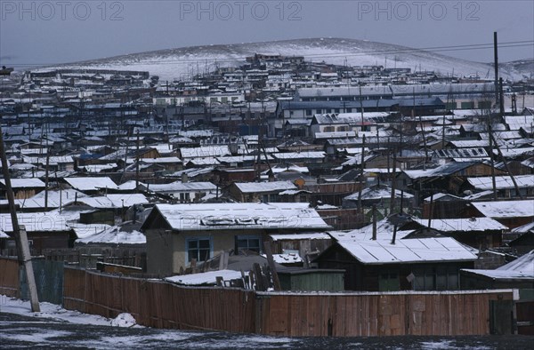 MONGOLIA, Ulan Bator, Snow covered rooftops of housing in city suburbs in winter.