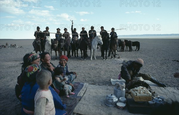 MONGOLIA, South Gobi, Festival, Gathering for ceremony of libation of first mare’s milk of the season.