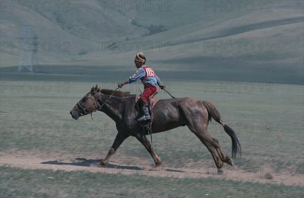 MONGOLIA, Animals, Child jockey  competing in National Day horse race.