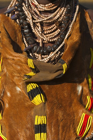 ETHIOPIA, Lower Omo Valley, Mago National Park, Womans traditional goatskin dress