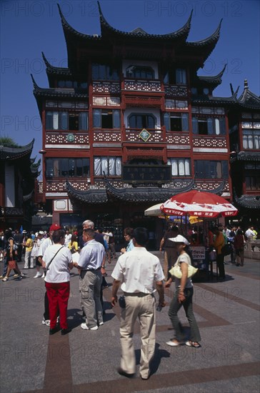 CHINA, Shanghai, "Yu Gardens street scene with shoppers, tourists, shops and souvenir stalls."