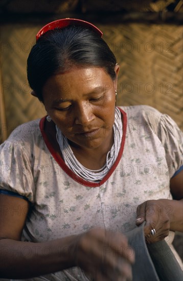 COLOMBIA, North West Amazon, Tukano Indigenous People, Barasana woman  Paulina  the headman Bosco's sister  making clay pot.Her death has marked the virtual extinction of pottery-making amongst the Barasana. Tukano sedentary Indian tribe North Western Amazonia American Colombian Columbia Female Women Girl Lady Hispanic Indegent Latin America Latino South America Tukano Female Woman Girl Lady One individual Solo Lone Solitary