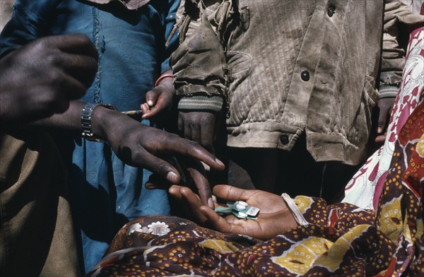 ETHIOPIA, Aid, Distribution of medicines by aid workers.  Cropped shot.