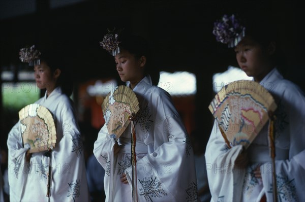 JAPAN, Honshu, Nara, "At Kasuga Shrine, the shrine maidens, miki, perform one of the sacred kagura dances.  Ancient dance form, with words of the musical accompaniment written by former Emperor Hirohito and expressing his wish for world peace."