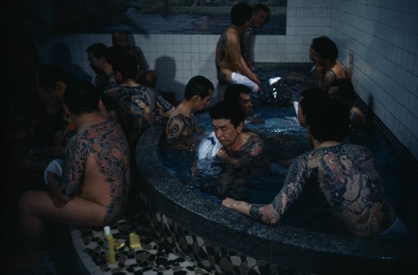 JAPAN, People, Yakuza, Heavily tattooed gangster or Yakuza gang members in public bath house.