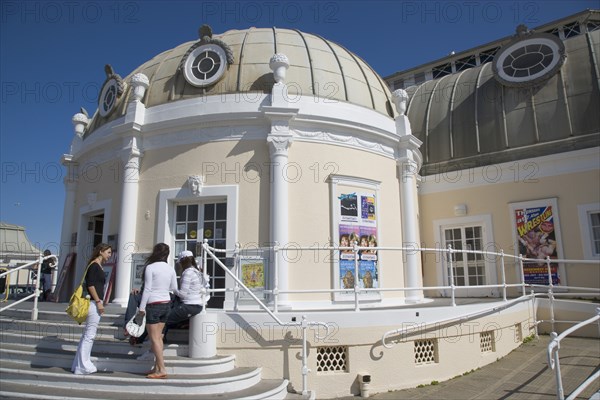 ENGLAND, West Sussex, Worthing, The Pavilion Theatre exterior with a group of girls on the steps outside.