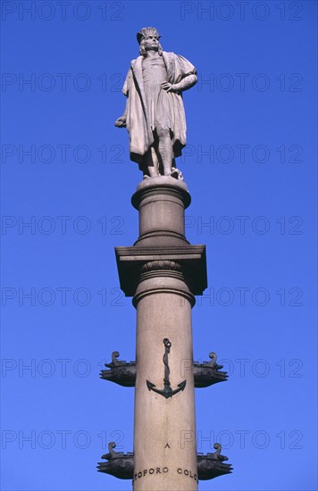 USA, New York, New York City, Columbus Circle.  Marble statue of Columbus on granite column decorated with bronze reliefs designed by sculptor Gaetano Russo.  Erected to commemorate the 400th anniversary of Columbus’ first voyage to the Americas.  Point at which distances to and from New York City are officially measured.