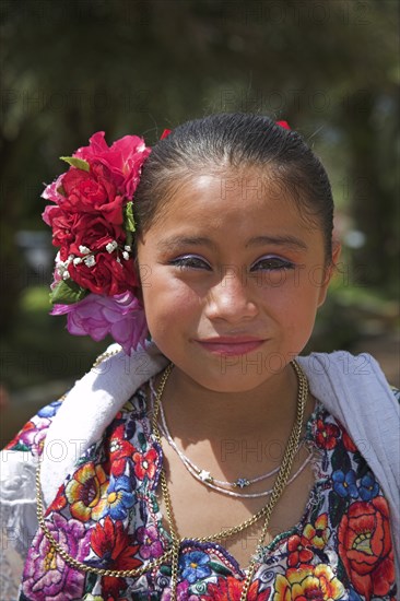 MEXICO, Yucatan, Chichen Itza, Young Mexican girl wearing traditional costume