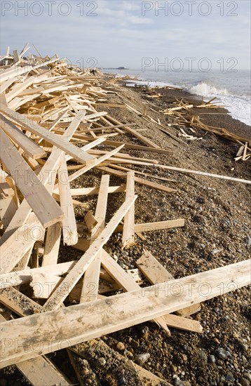 ENGLAND, West Sussex, Worthing, Timber washed up on the beach from the Greek registered Ice Princess which sank off the Dorset coast on 15th January 2008. Worthing Pier in the distance