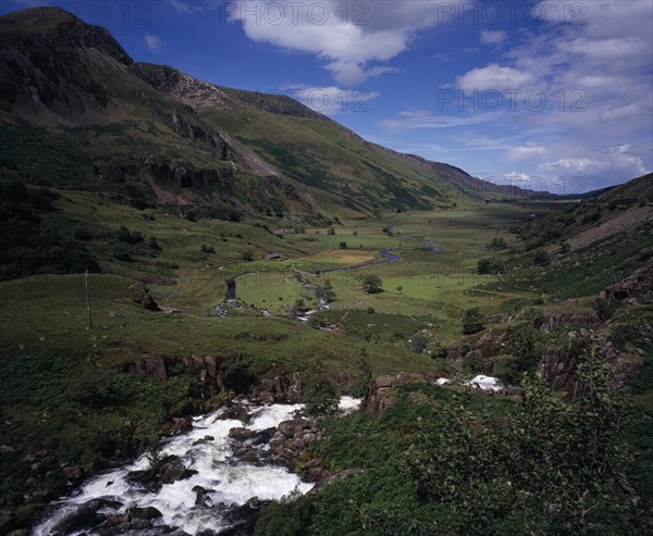WALES, Gwynedd, Snowdonia National Park, "View west over Nant Ffrancon Valley from Ogwen Falls.  River winding across valley floor with small cultivated fields and pasture between steep, eroded hillsides."