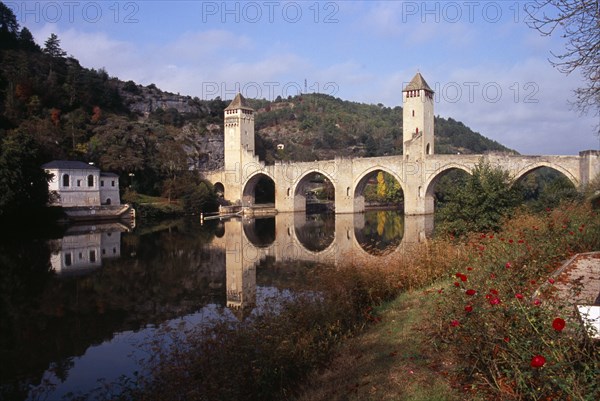 FRANCE, Midi Pyrenees, Cahors, Pont Valentre. Bridge over the River Lot built between 1308 and 1378 with Gothic arches and square towers.