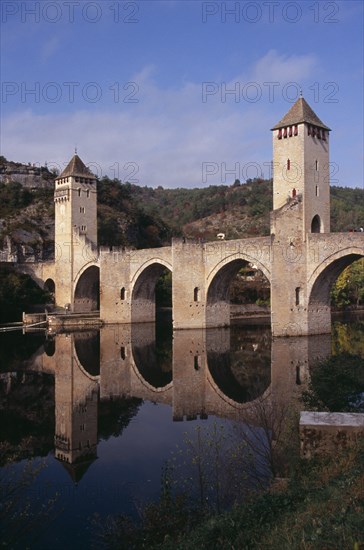 FRANCE, Midi Pyrenees, Cahors, Pont Valentre. Bridge over the River Lot built between 1308 and 1378 with Gothic arches and square towers.