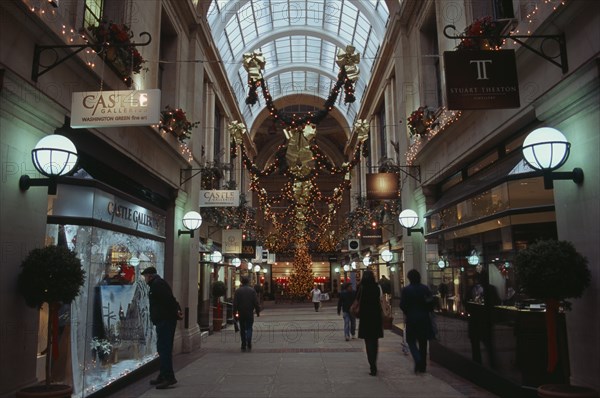 ENGLAND, Nottinghamshire, Nottingham, Exchange Arcade interior decorated at Christmas with people shopping