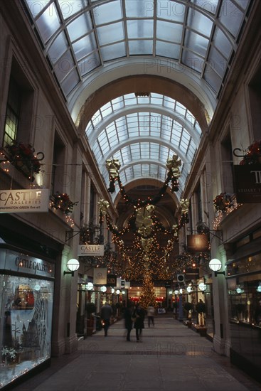 ENGLAND, Nottinghamshire, Nottingham, Exchange Arcade interior decorated at Christmas with people shopping