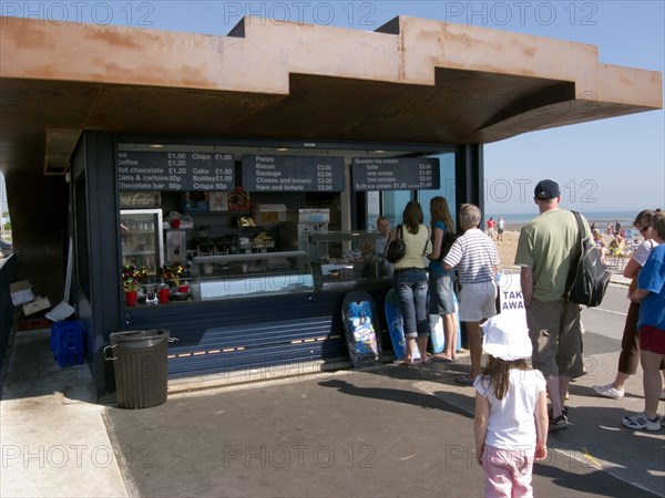 ENGLAND, West Sussex, Littlehampton, Customers queuing at the East Beach Cafe designed by Thomas Heatherwick