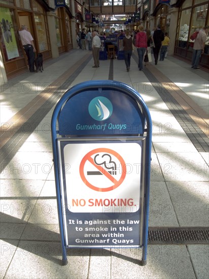 ENGLAND, Hampshire, Portsmouth, No Smoking sign in the Gunwharf Quays shopping complex