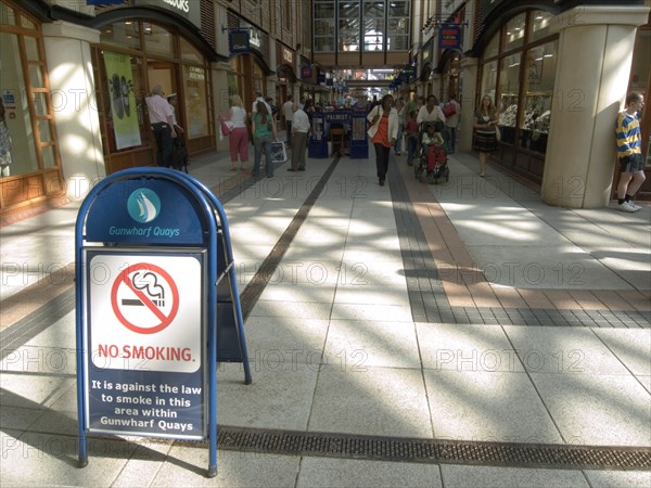 ENGLAND, Hampshire, Portsmouth, No Smoking sign in the Gunwharf Quays shopping complex