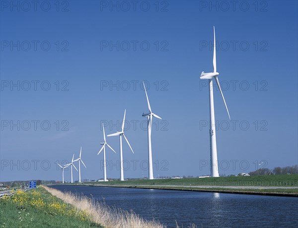 HOLLAND, Noord Holland, Alkmaar, Row of Wind turbines along the Noord Hollands Kanaal north of Alkmaar