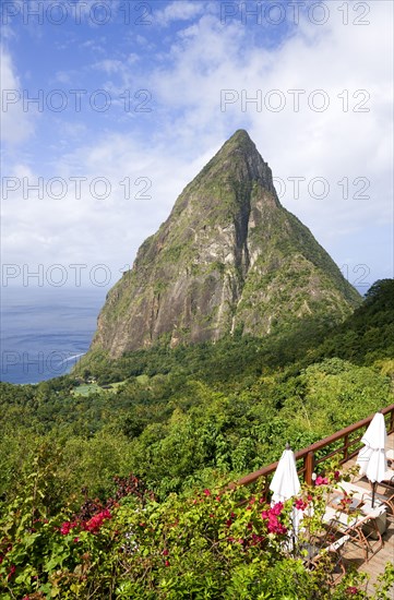 WEST INDIES, St Lucia, Soufriere , Val des Pitons The volcanic plug of Petit Piton and the lush valley seen from the sun deck of the Ladera Spa Resort Hotel