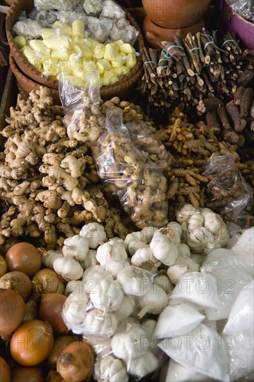 WEST INDIES, St Lucia, Castries, "Market stall with local produce of herbs and spices including ginger, galangal, garlic and onions"