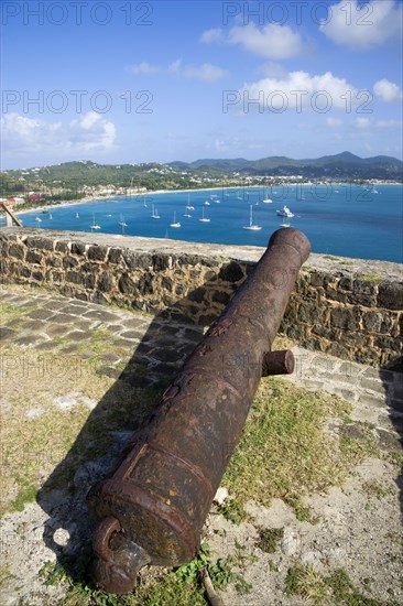 WEST INDIES, St Lucia, Gros Islet , Pigeon Island National Historic Park Cannon on Fort Rodney overlooking Rodney Bay