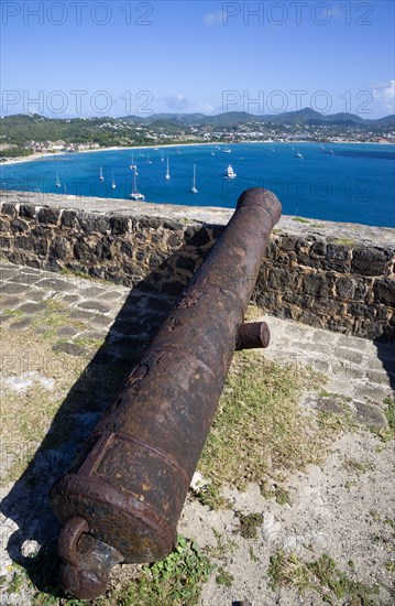 WEST INDIES, St Lucia, Gros Islet , Pigeon Island National Historic Park Cannon at Fort Rodney overlooking Rodney Bay