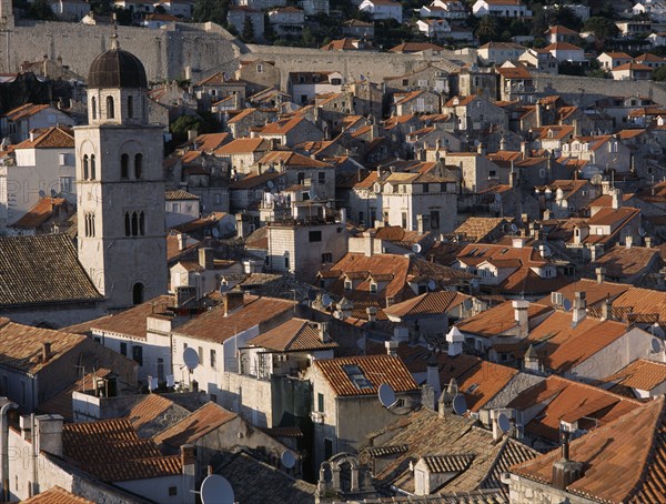 CROATIA, Dalmatia, Dubrovnik, The Franciscan Monastery Bell Tower and terracotta tiled roof tops with satellite dishes