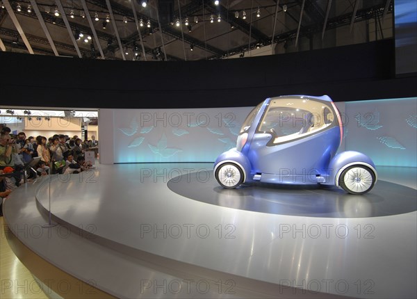 JAPAN, Honshu, Chiba, "2007 Tokyo Car Show, crowd viewing the Nissan concept car Pivo 2"