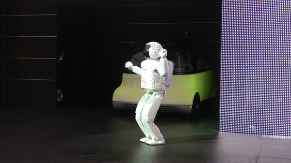 JAPAN, Honshu, Chiba, "2007 Tokyo Car Show, Asimo Robot introduces Honda concept car Puy"