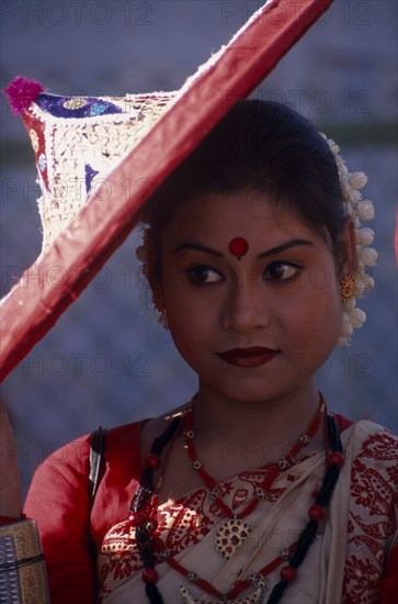 INDIA, Rajasthan, Jaipur, Portrait of female dancer with conical hat at the Jaipur Heritage Festival