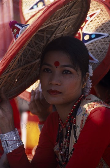INDIA, Rajasthan, Jaipur, Portrait of a female dancer with conical hat at the Jaipur Heritage Festival