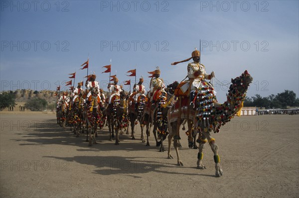 INDIA, Rajasthan, Jaisalmer, Border Security Force soldiers performing the Camel Tattoo at the Desert Festival