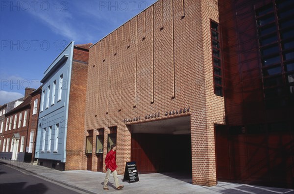 ENGLAND, West Sussex, Chichester, Pallant House Gallery exterior with a man wearing a red jacket walking past entrance