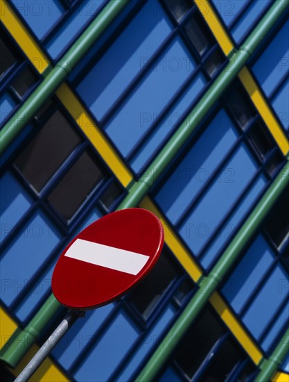 HOLLAND, Noord Holland, Amsterdam, Detail of No Entry road sign with modern colourful apartments behind. Near Zuiderkerk Church