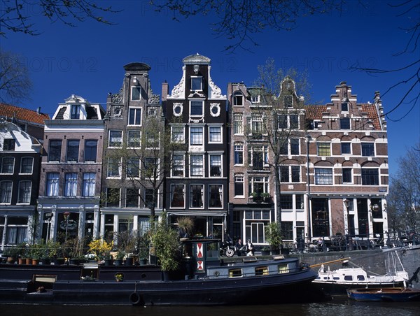 HOLLAND, Noord Holland, Amsterdam, Traditional canal side house facades in the Brouwergracht Canal area south east of Railway Station