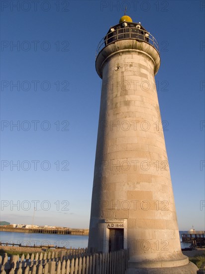 ENGLAND, West Sussex, Shoreham-by-Sea, Lighthouse on Kingston Beach next to Shoreham Harbour in golden evening light
