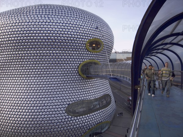 ENGLAND, West Midlands, Birmingham, Exterior of Selfridges department store in the Bullring shopping centre. People on elevated walk way to the carpark.