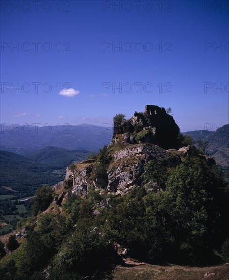 FRANCE, Midi-Pyrenees, Ariege, "Chateau de Roquefixade,  Ruined castle on cliff-top overlooking village of Roquefixade.  Site of refuge for the Cathars during the Albigensian Crusade."