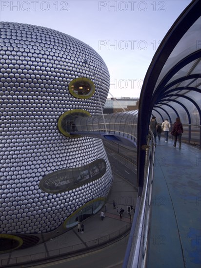 ENGLAND, West Midlands, Birmingham, Exterior of Selfridges department store in the Bullring shopping centre. People on elevated walkway to the carpark.