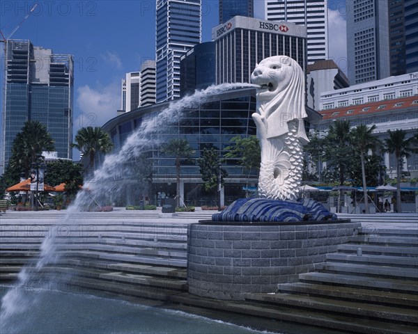 SINGAPORE, Merlion Park, "The Merlion statue at the Merlion Park river entrance with HSBC Bank, Tung Centre and other city skyscrapers behind."
