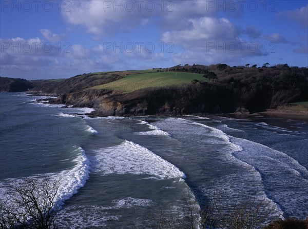 ENGLAND, Cornwall, Porthluney Cove, "Sea and coastline west of Dodman Point. Sheltered, sandy cove with trees and fields sloping away to cliffs."
