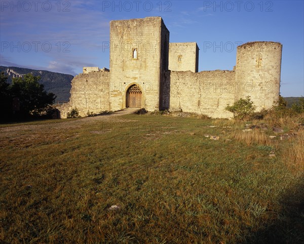 FRANCE, Languedoc-Roussillon, Aude, "Chateau Puivert, Cathar castle stronghold in the thirteenth century.  East gate and fortified walls and turrets."