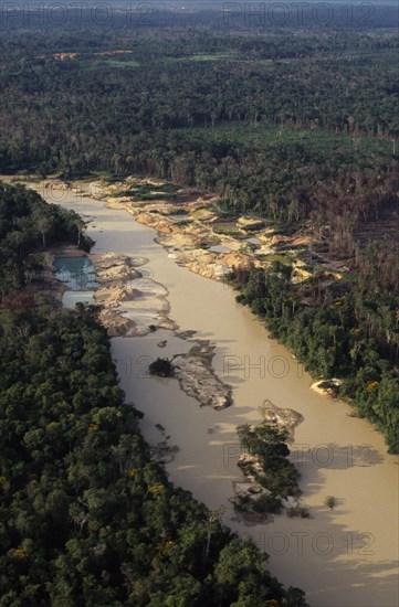BRAZIL, Matto Grosso, Peixoto de Azevedo, Aerial view over Peixoto River. Now a Garimpo  Gold mine on former Panara territory  showing gold-workings  deforestation and pollution from mercury.