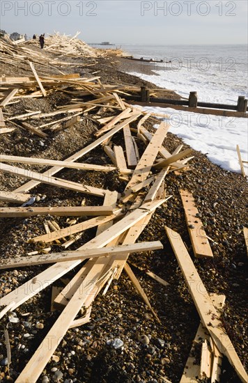 ENGLAND, West Sussex, Worthing, Timber wood planks washed up on the beach seafront from the wreckage of the Greek registered ship Ice Princess which sank off the Dorset coast on 15 January 2008. Worthing Pier in the distance