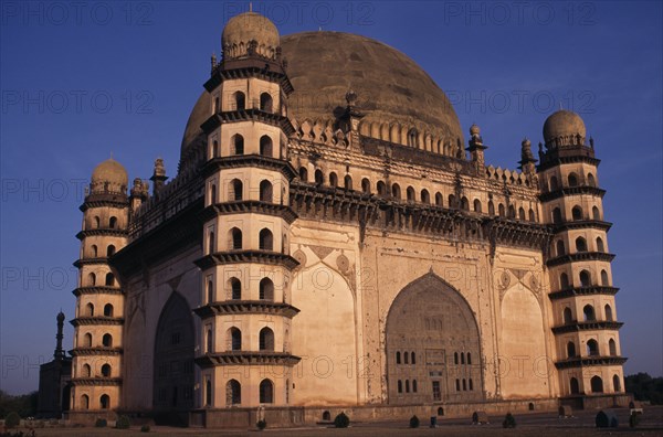 INDIA, Karnataka, Bijapur, The Golgumbaz.  Exterior of domed building with octagonal seven-storey towers at each corner.  Built in 1659 as the mausoleum of Mohammed Adil Shah.