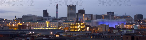 ENGLAND, West Midlands, Birmingham, City skyline illuminated in evening light