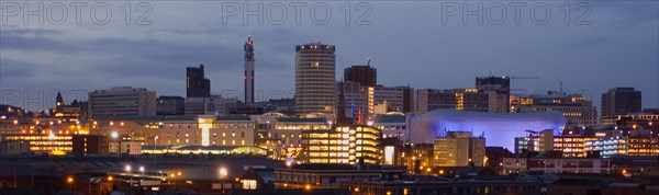 ENGLAND, West Midlands, Birmingham, City skyline illuminated in evening light