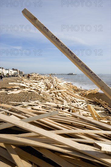 ENGLAND, West Sussex, Worthing, Timber washed up on the beach from the Greek registered Ice Princess which sank off the Dorset coast on 15th January 2008. A plank stands upright with the words The Grand Worthing Wood Disaster 2008 written on it