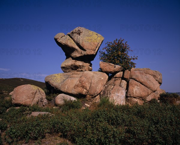 FRANCE, Languedoc-Roussillon, Pyrenees-Orientales, Granite rock formation known as ‘Roc Cornut’.  Anvil-shaped boulder appearing to balance on another.