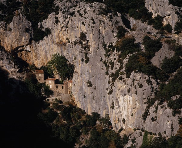 FRANCE, Languedoc-Roussillon, Aude, Gorge de Galamus.  South end with tenth century Hermitage St Antoine de Galamus set into rock face.